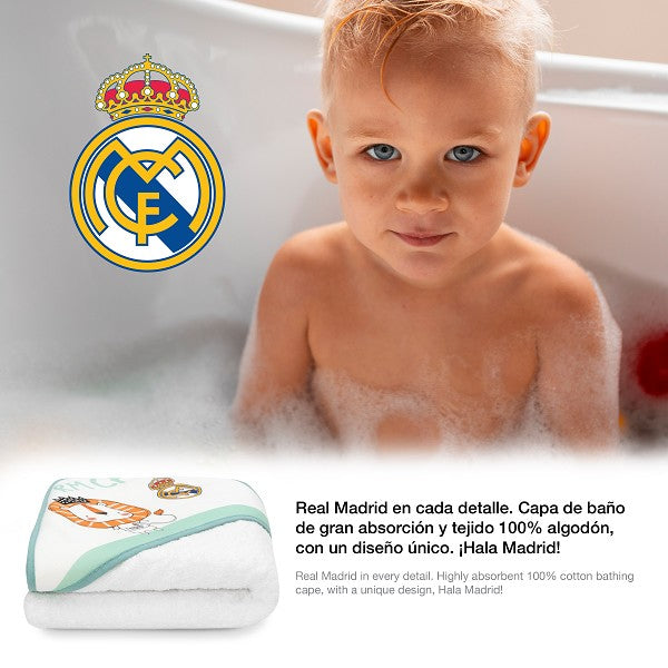 Capa de baño blanca para bebé con capucha, logo Real Madrid bordado en azul y dorado, tejido suave algodón 100%.