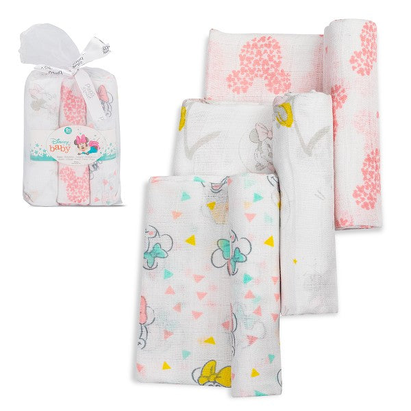 Tres muselinas blancas con estampados de Minnie Mouse en colores rosa, amarillo y gris, presentadas en un paquete con moño.
